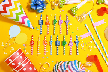 Birthday party decorations on yellow background. Minimalism concept