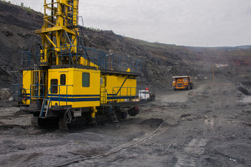 The drilling rig drills a hole for the subsequent laying of explosives into it. Industrial Blast Prep