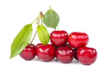 Sweet cherries with green leafs isolated on white background