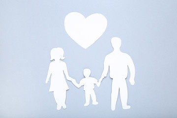 Family figures with heart on grey background
