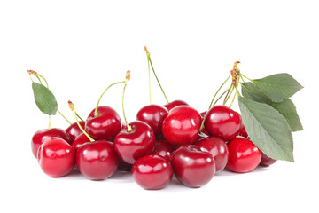 Sweet cherries with green leafs isolated on white background