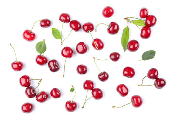 Obraz na płótnie Canvas Sweet cherries with green leafs isolated on white background