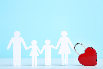 Family figures with red heart on blue background