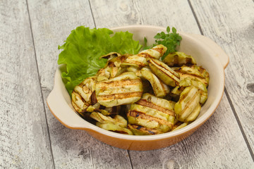 Grilled eggplant slices served basil