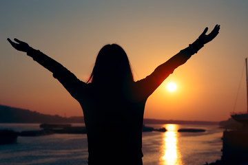Hopeful Woman Looking at the Sunset by the Sea