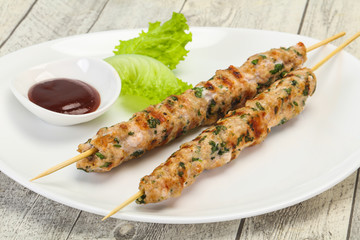 Minced pork skewer kebab with sauce