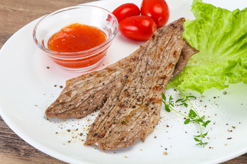 Grilled Thick pork steak served salad