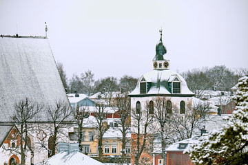 Old historic Porvoo, Finland with wooden houses and medieval stone and brick Porvoo Cathedral under white snow in winter - 287442014
