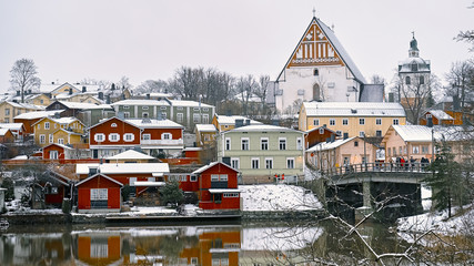 Old historic Porvoo, Finland with wooden houses and medieval stone and brick Porvoo Cathedral under white snow in winter - 287442038