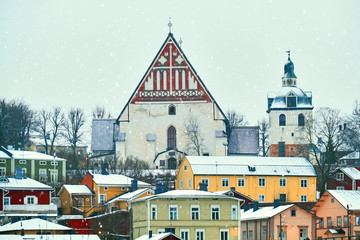 Old historic Porvoo, Finland with wooden houses and medieval stone and brick Porvoo Cathedral under white snow in winter - 287442085