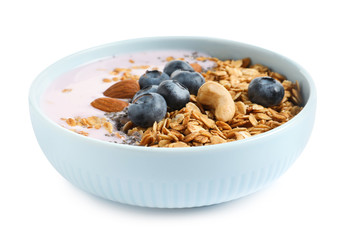 Bowl of tasty yogurt with blueberries and oatmeal on white background
