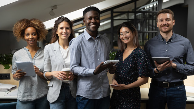 Smiling multiracial business team with african male leader portrait