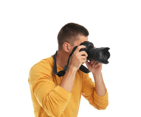 Young professional photographer taking picture on white background