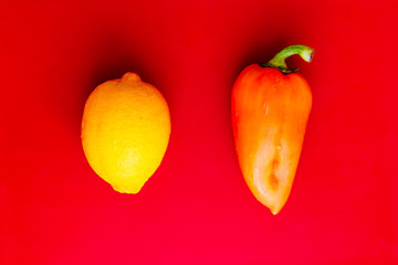 fresh fruits and vegetables on red background