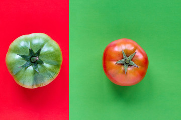 Colorful pattern from of red tomato on green background and green natural tomato on red background. Closeup, top view