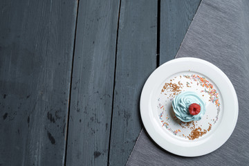 Fototapeta na wymiar Cake, muffin, celebrate muffin with cream and decoration