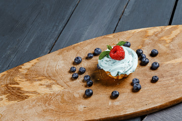 Cake, muffin, celebrate muffin with cream and decoration