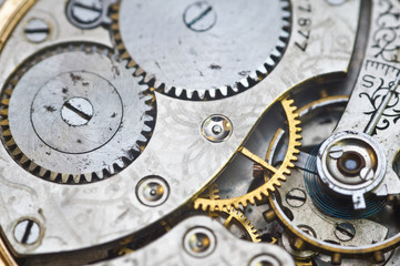 Clockwork, gears in an old watch. Teamwork concept, idea, technology, eternity, business. Macro