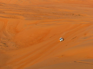 Fototapeta na wymiar SUV tour Sunset at the Wahiba Sands (Rimal Al Wahiba, Ramlat al Wahiba, Wahiba Sands, Scharqiyya Sands) Sultanate of Oman