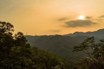 a horizontal shot of sunset landscape in the mountains of hong kong china