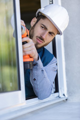 construction worker sets of metal and plastic window