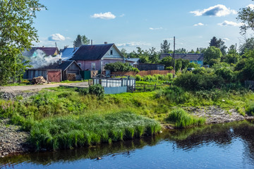 Fototapeta na wymiar Village landscape on the Shuya river in summer