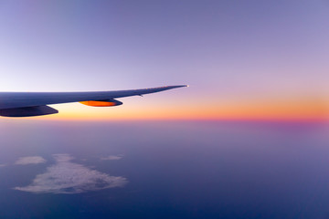 Fototapeta na wymiar Traveling by air transport plane wing