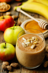peanut butter smoothie with milk, chocolate, apples, banana and oats