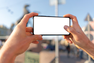 guy takes pictures on a smartphone. white screen mockup