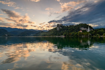 Evening (golden hour) landscape on Lake Bled with reflection and beautiful sky.