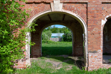 Fototapeta na wymiar Manor of the Nechaevs: view through the arch in the transition between the central part of the house and the wing, Polibino village, Dankov district, Lipetsk region, Russian Federation