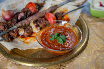 Arabic Barbecue food with fresh tomato sauce and garlic 