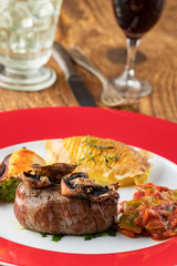 grilled steak on a plate with wine