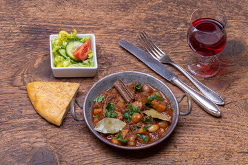 greek stifado on dark wood
