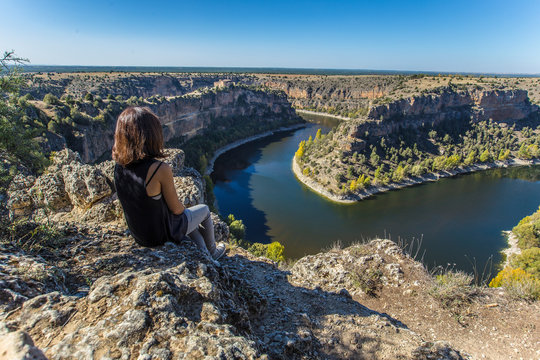 A young girl looking at the Hoces del Duraton in Segovia, spain