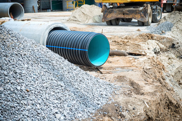 Big pipe or tube for water sewer on construction site during road repair