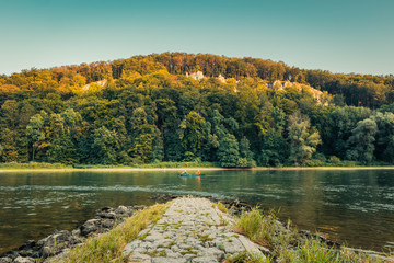 Panorama view on people rowing in canoe on the Danube Gorge in Weltenburg Kelheim in Bavaria Germany
