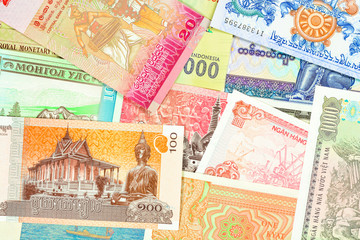 Old paper banknotes from exotic countries of Asia and Africa. Colorful money background. Close up high resolution.