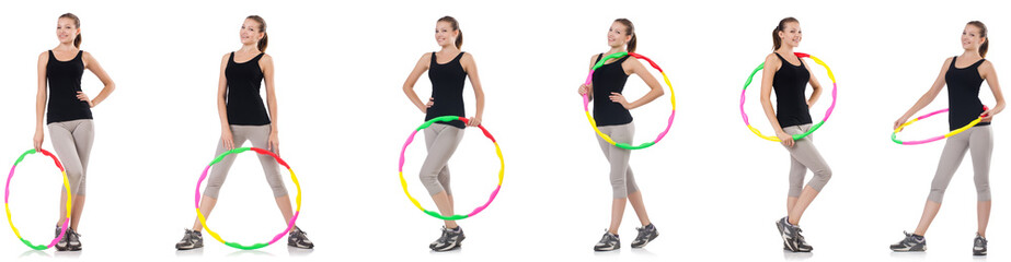 Young woman with hula hoop isolated on white © Elnur