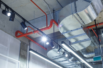Industrial utilities under the ceiling. Ventilation, air conditioning, lighting and fire fighting.