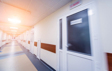 Empty long corridor in the modern clinic.