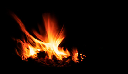 Fototapeta na wymiar Сooking on a cauldron on a fire. Flames of fire in the dark.