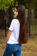 Female brunette hair, rear view, summer park