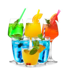 Glasses of cold cocktails on color background