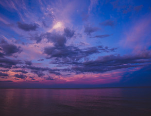 Fototapeta na wymiar Colorful sky after the sunset on the beach