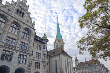 Fototapeta na wymiar Stadthaus Zürich (government building) and Fraumünster Church, shot in Zürich, Switzerland.