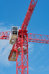 close up of the cabin of a red construction crane