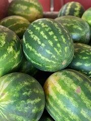 watermelons on display at the farmers market
