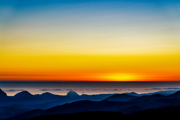 Sunset over Ocean, Silhouetted Hills