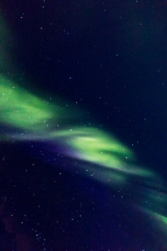 Northern Boreal Lights in the sky while sailing across the northwest passage in Canada.